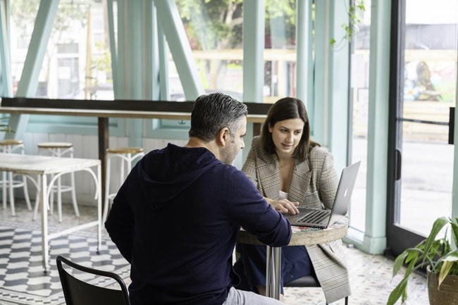 A salesperson engages a customer at the bottom of the sales funnel